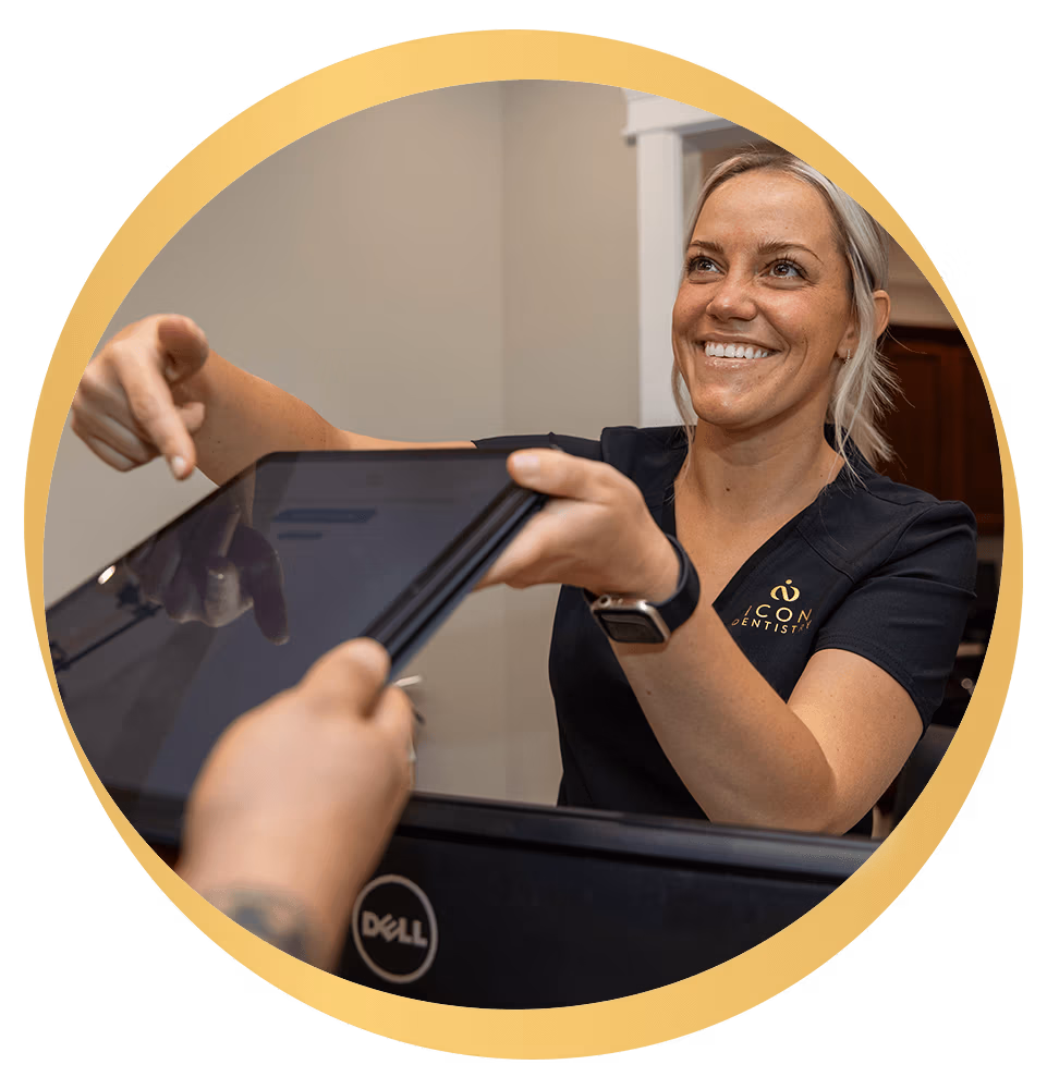 Team member handing tablet to Patient